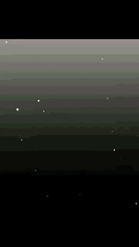 a computer generated image of a field with trees and a road in the background