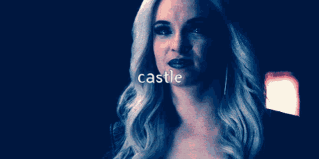 a woman with blonde hair is smiling and the word castle is above her