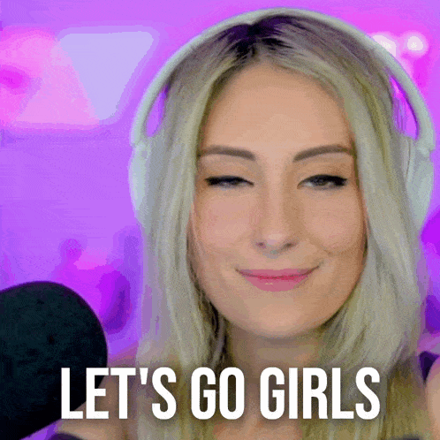a woman wearing headphones is smiling and saying let 's go girls