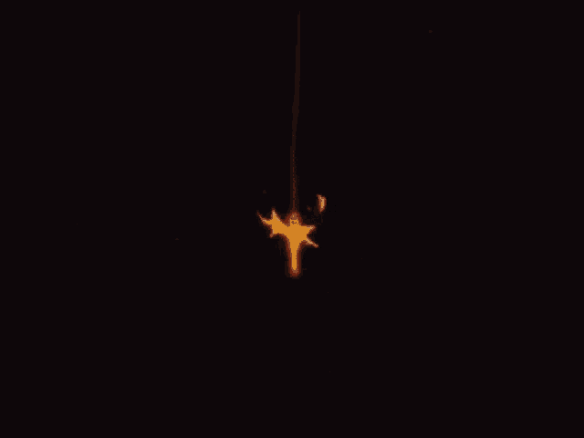 a firework is lit up in the dark with sparks