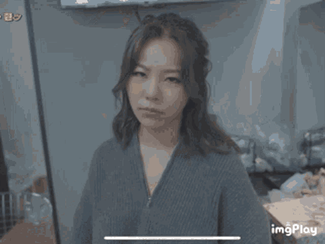 a woman is making a heart shape with her hand and the word suck is written above her