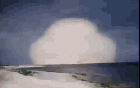 a painting of a nuclear explosion over a body of water .