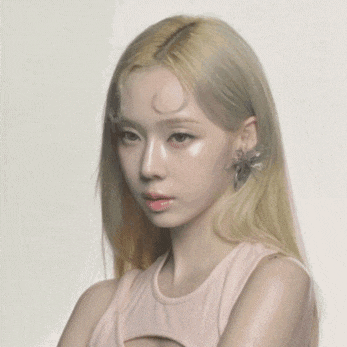 a close up of a woman wearing a pink tank top