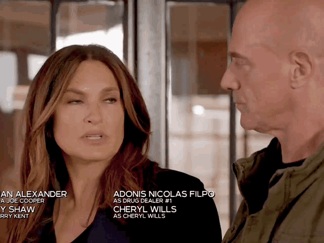 a man and a woman are standing next to each other and the woman 's name is alexander