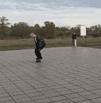 a man is riding a skateboard on a tiled floor