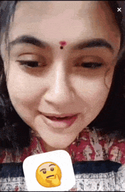 a close up of a woman 's face with a smiley face on it