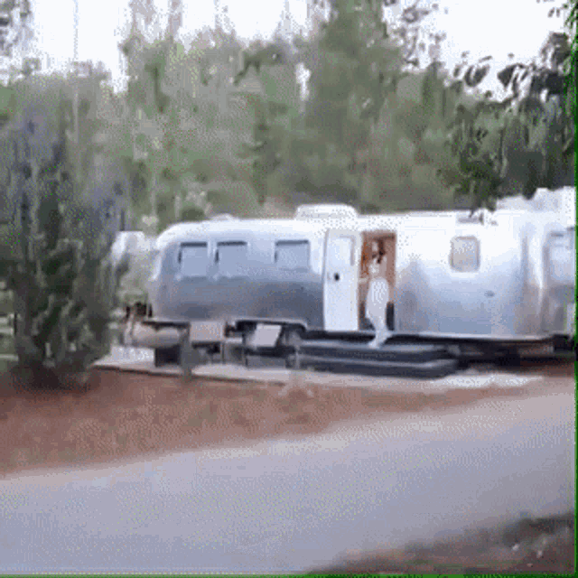 an airstream is parked on the side of the road