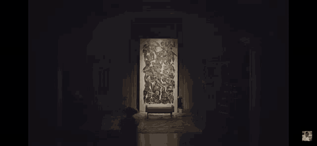 a dark room with a painting on the wall and the word thing above it