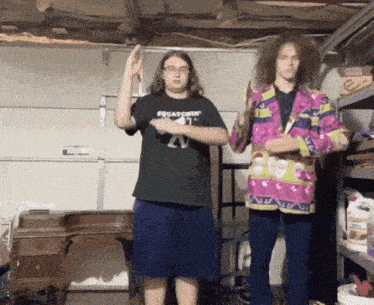 a man wearing a shirt that says squiatchin stands next to another man