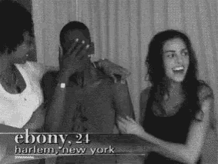 a black and white photo of two women and a man with the name ebony 24