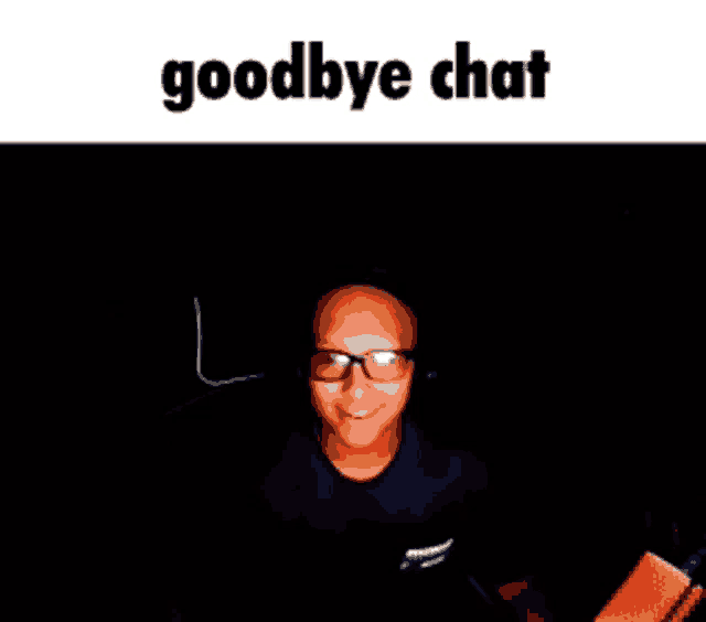 a man wearing glasses and headphones is sitting in front of a microphone with the words goodbye chat above him