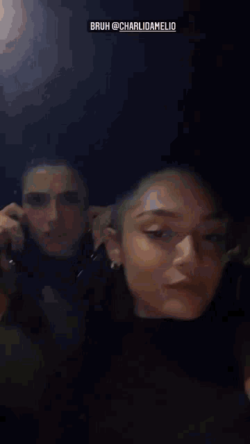 a woman talking on a cell phone with the name charlidamelio written above her