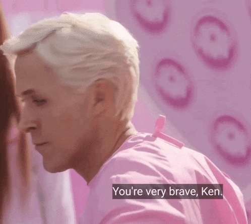 a man in a pink shirt with the words you 're very brave ken