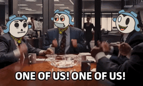 a group of people sitting around a table with one of them saying one of us one of us
