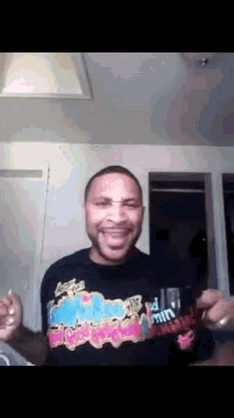 a man wearing a black shirt that says coca cola
