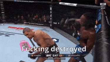a fighter in a cage with the words " fucking destroyed " on the screen