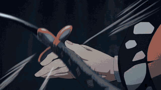 a close up of a person holding a sword