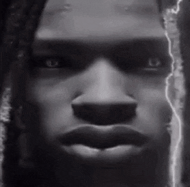 a black and white photo of a man 's face with a lightning bolt coming out of it .