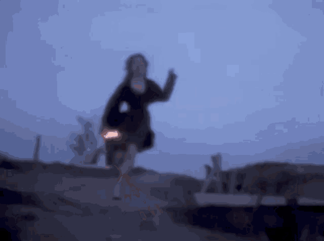 a blurry picture of a person in a black sweater