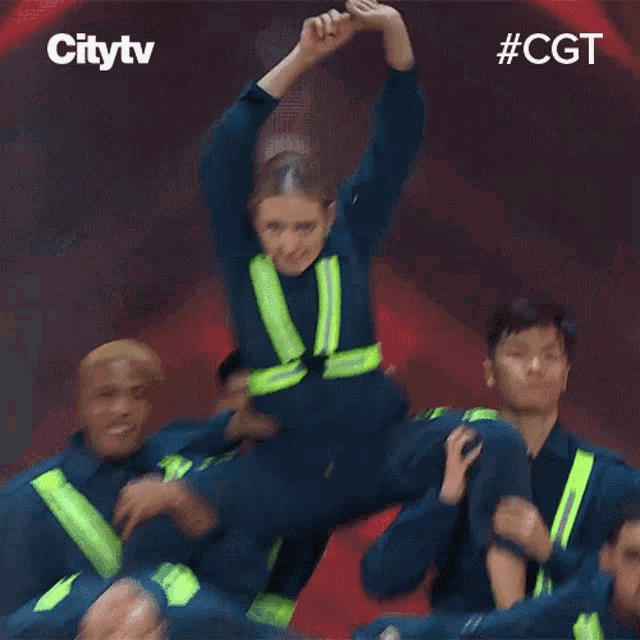 a group of firefighters are dancing on a stage and the hashtag #cgt is on the bottom
