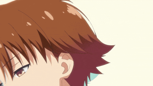 a close up of a person 's face with red hair