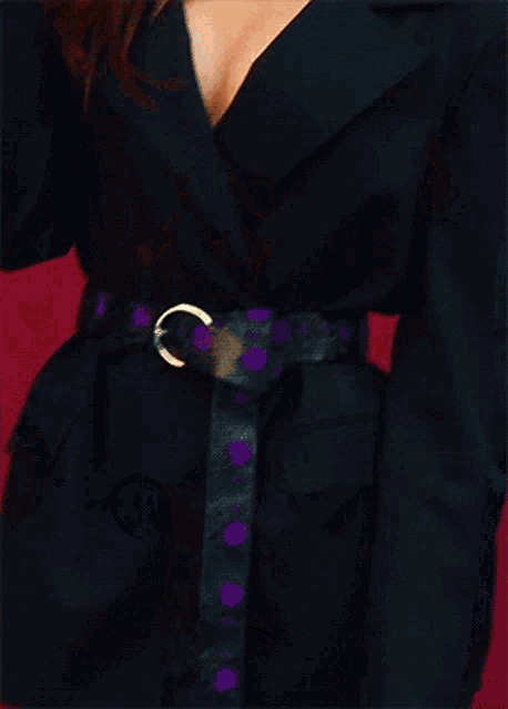 a woman wearing a choker with a key pendant