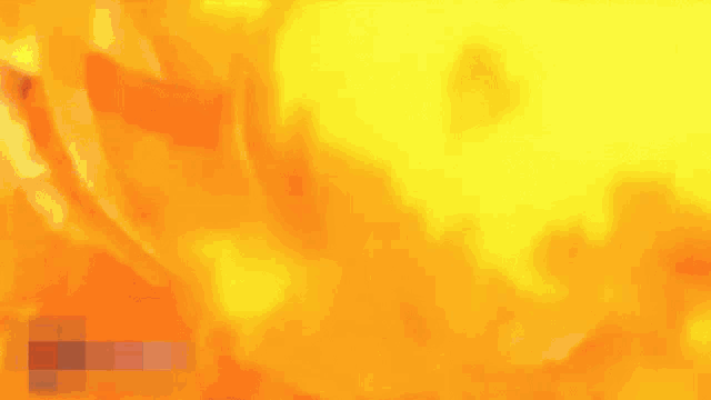 a man is standing in front of a large fire