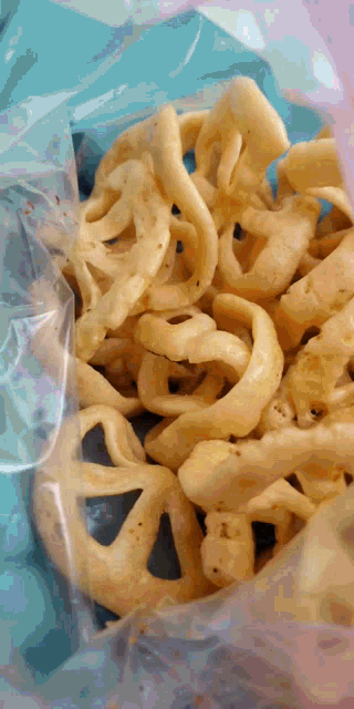 a close up of a bag of snacks that looks like a pretzel