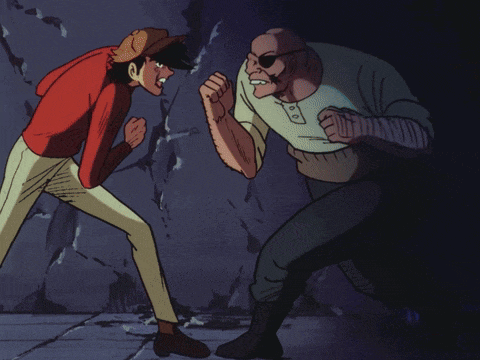 a woman in a red shirt is hugging a man in a brown sweater