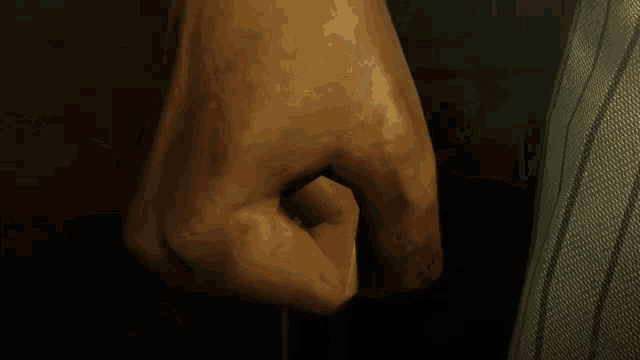 a close up of a man 's face with his eyes closed and his mouth open