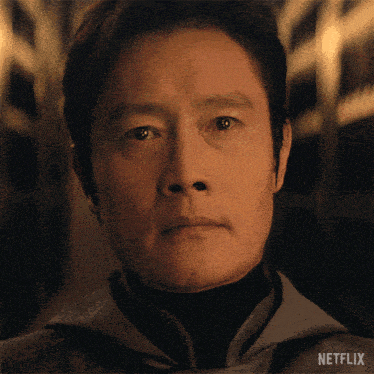 a close up of a man 's face with netflix written on the bottom right