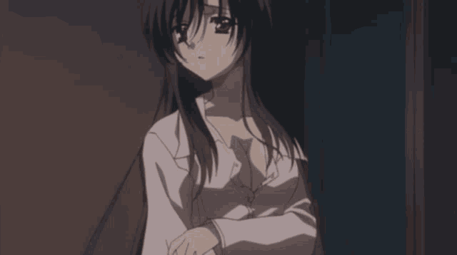 a girl with long black hair and a white shirt on
