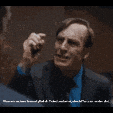 a man in a suit shakes hands with another man