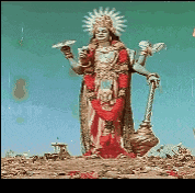 a statue of a woman with a sun on her head holding a torch