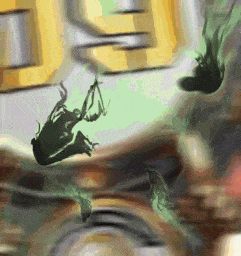 a blurry picture of a frog falling from a cliff