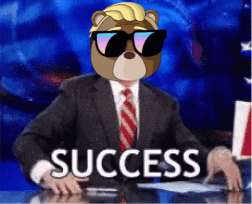 a man in a suit and tie is sitting at a desk with the word success written on it