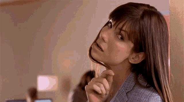 a close up of a woman 's face with a caption that says ' a duff '