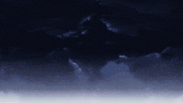 a dark cloudy night sky with a few stars in it