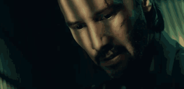 a close up of a man 's face with blood on his face .