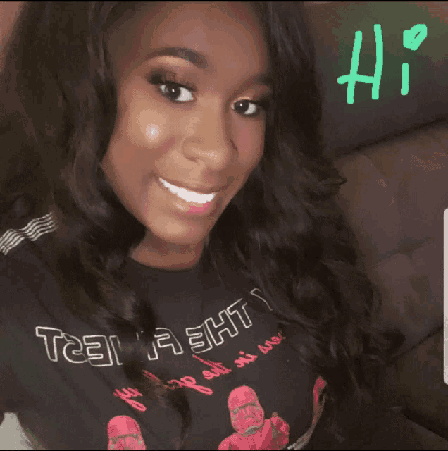 a woman wearing a t-shirt that says team a3ht