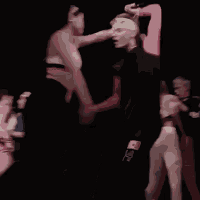 a blurry picture of a man carrying another man in his arms
