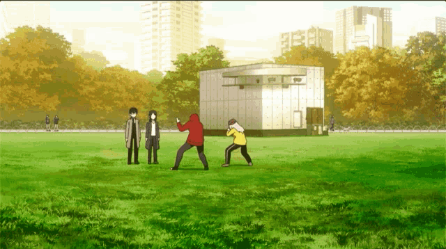 a group of people standing in a grassy field in front of a building