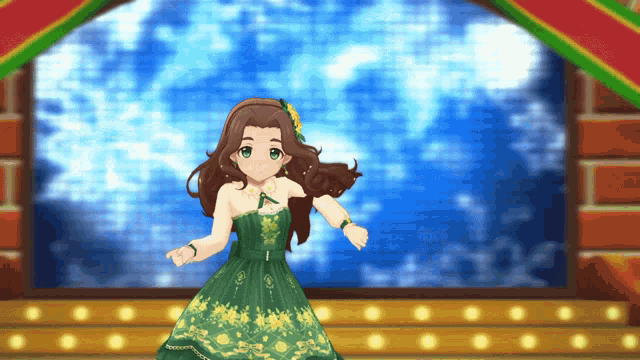 a girl in a green dress is on a stage