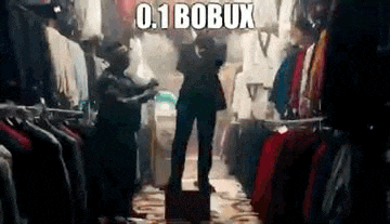 a man is standing in a room filled with clothes and a sign that says `` 0.1 bobux '' .