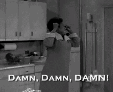 a black and white photo of a woman covering her face with her hands and the words `` damn , damn , damn '' .