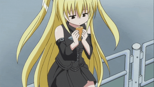 a girl with blonde hair and a black dress is holding a cone in her hands