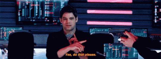 a man is pointing at another man holding a gun and says " yes do that please "