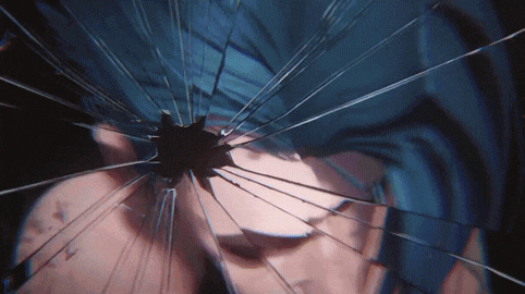 a close up of a person 's face in a broken mirror