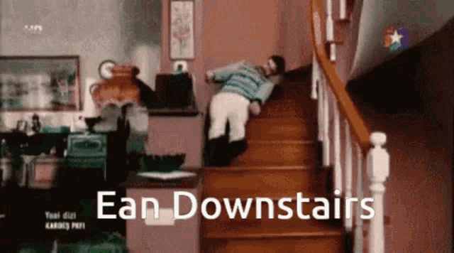 a man is falling down a set of stairs with the words ean downstairs in the corner