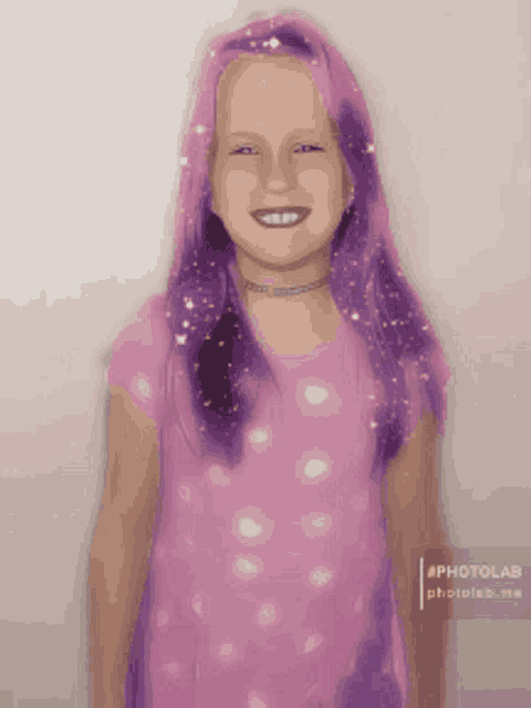 a young girl with purple hair and a pink shirt